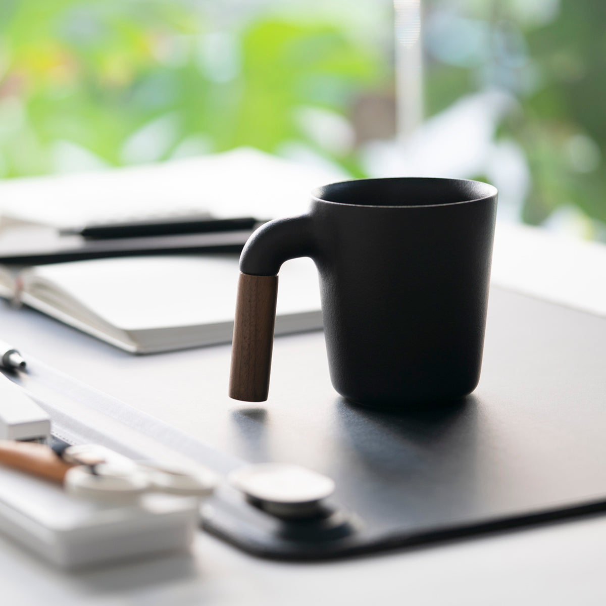 HMM signature product. Unique ceramic with walnut wood mug.