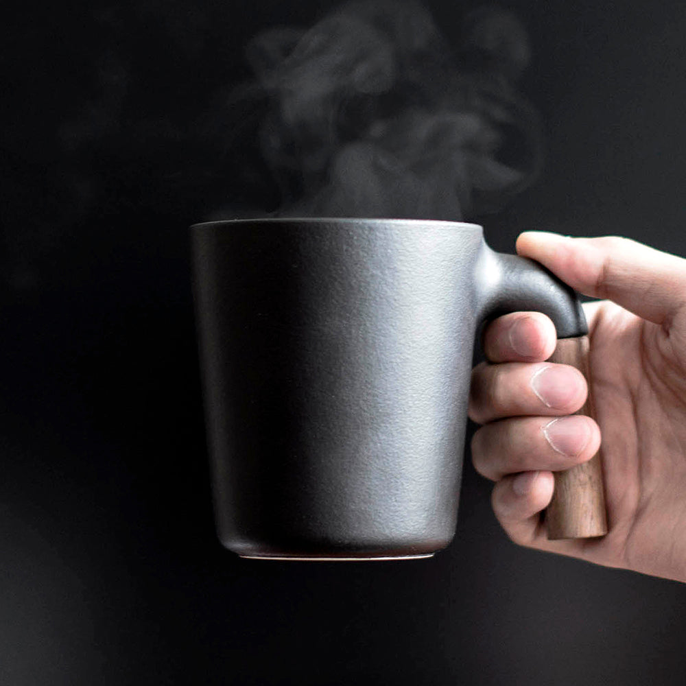 A balanced mug. Unique ceramic with walnut wood mug.