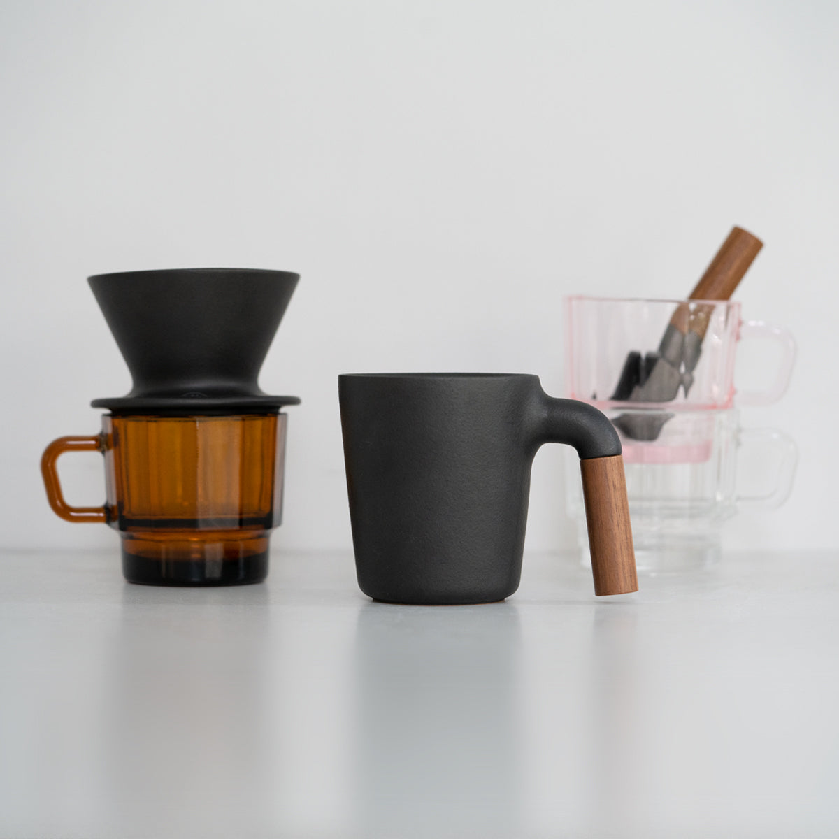 HMM coffee collection - ceramic mug and dripper, cast iron scoop and recycled glass cup.