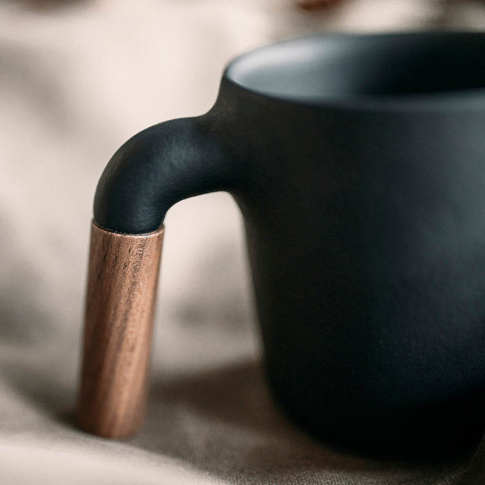 HMM signature product. Unique ceramic with walnut wood mug.